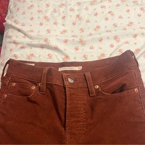 In this orange reddish color straight leg pants